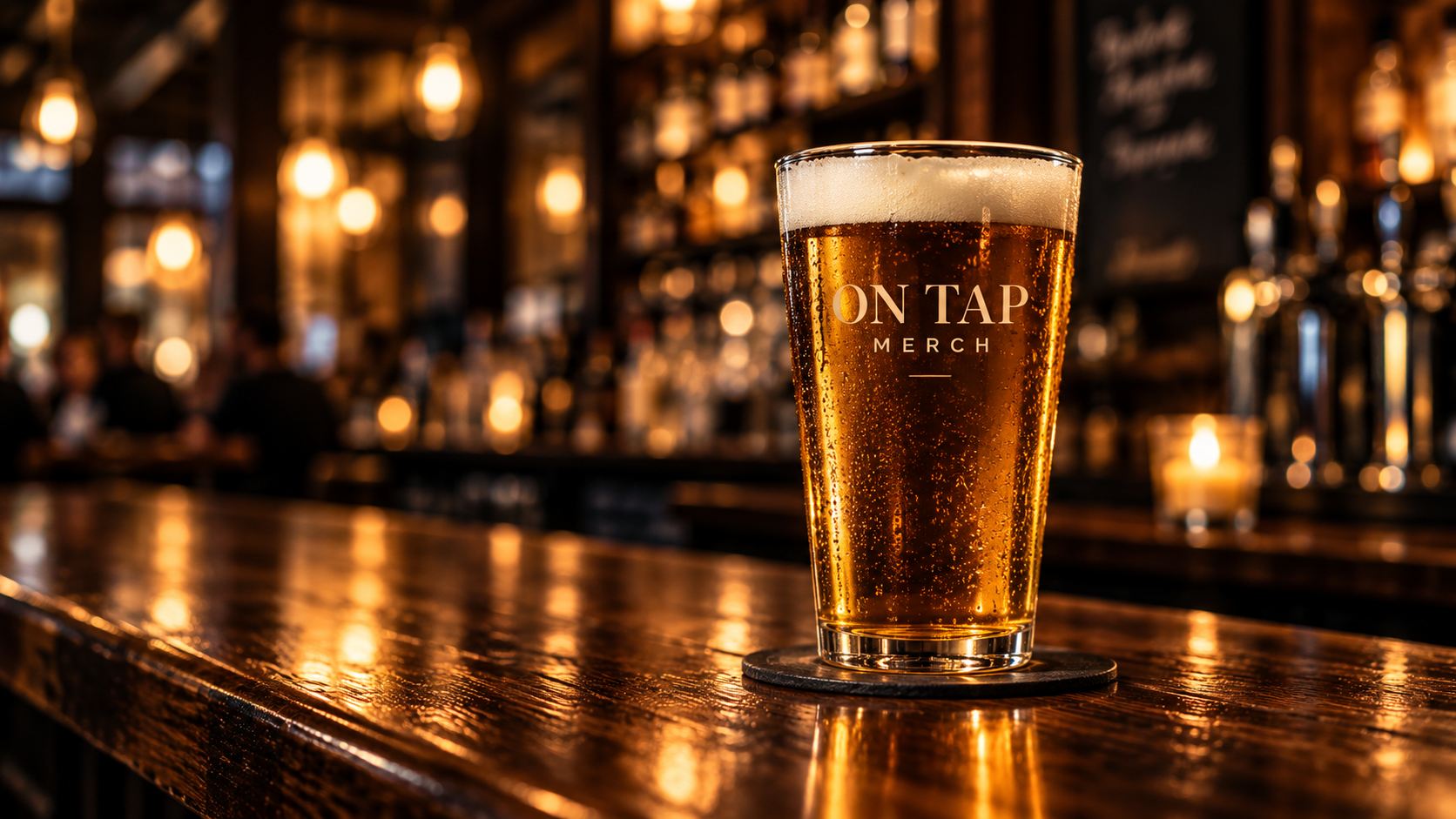 On Tap Merch branded pint glass on a bar